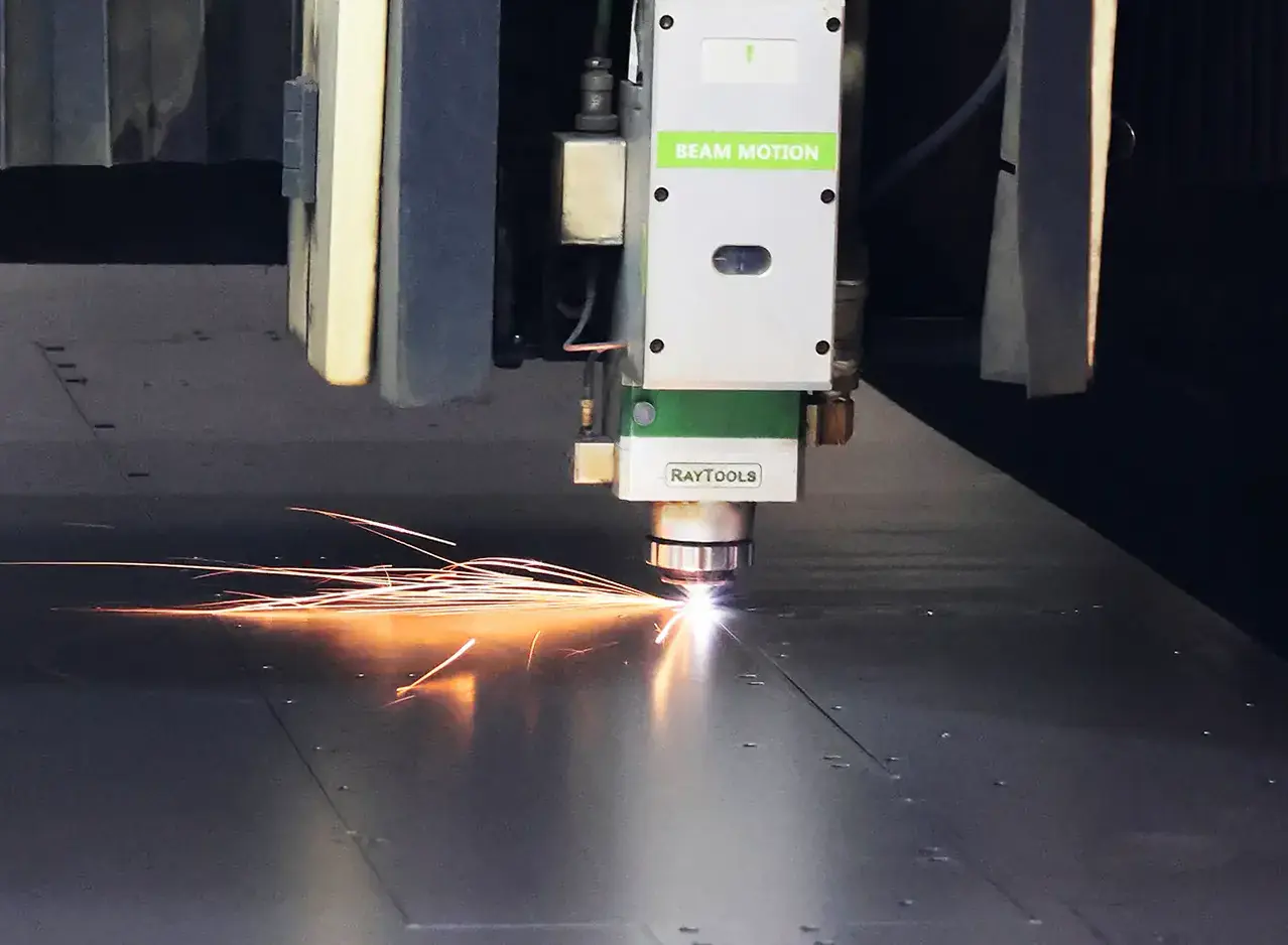 Fiber laser cutting machine processing sheet metal for custom fabrication