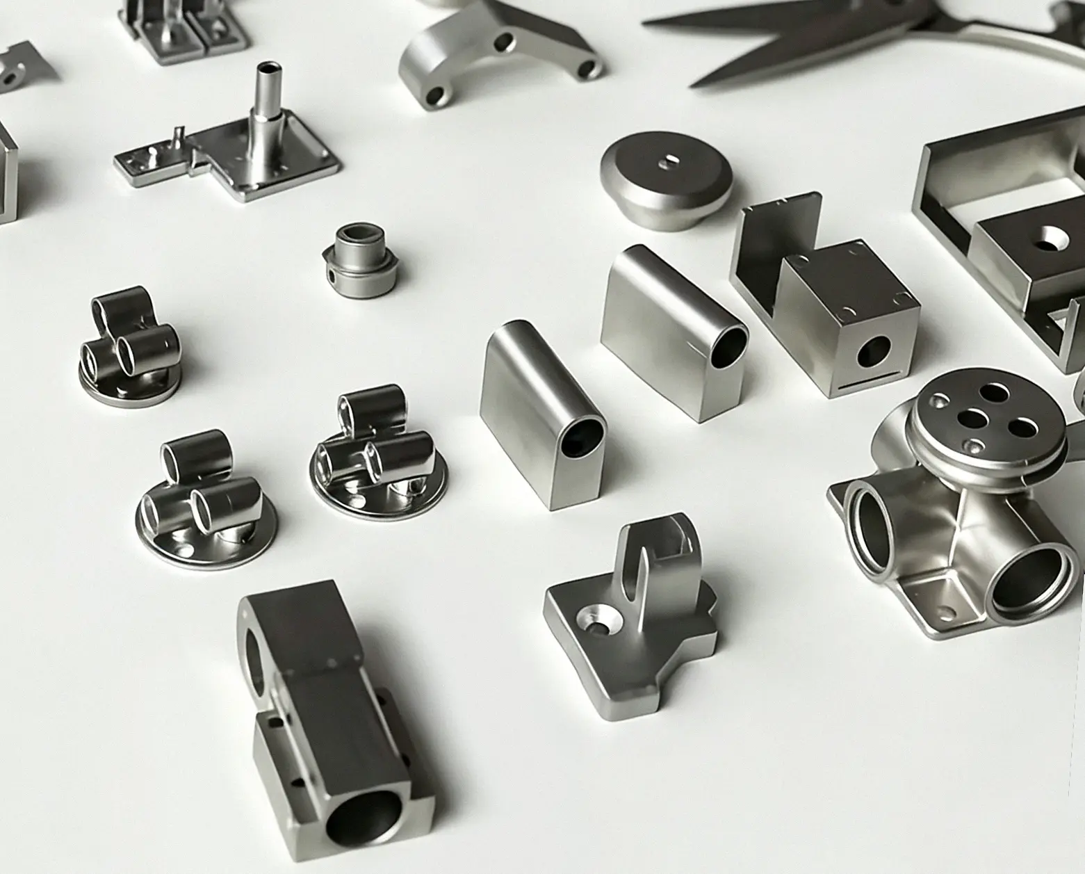 Assortment of CNC-machined stainless-steel and aluminum parts