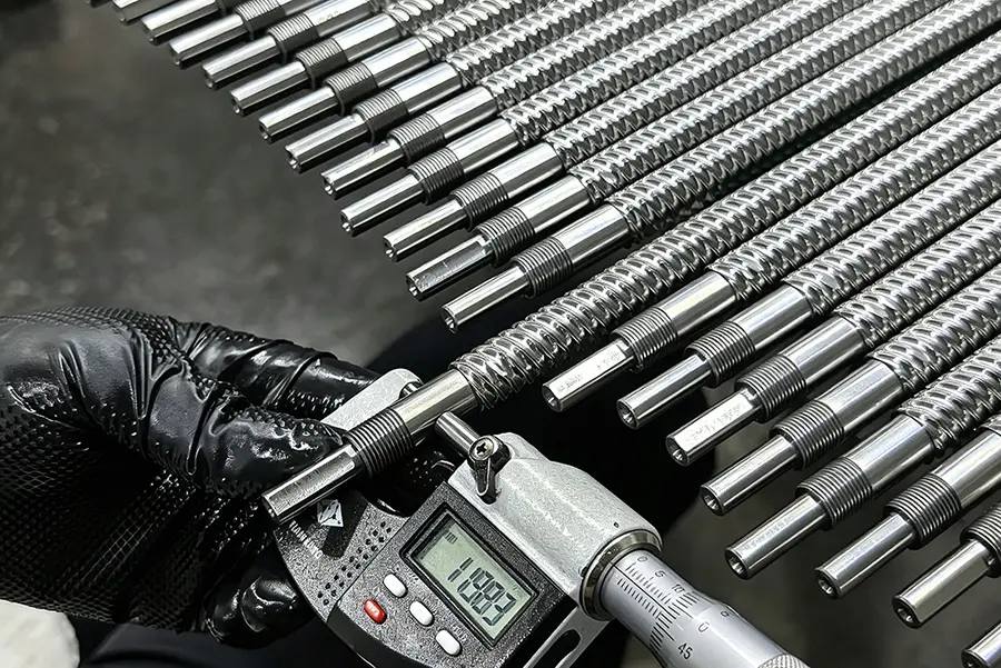 Inspection machine checking a finished CNC-turned part