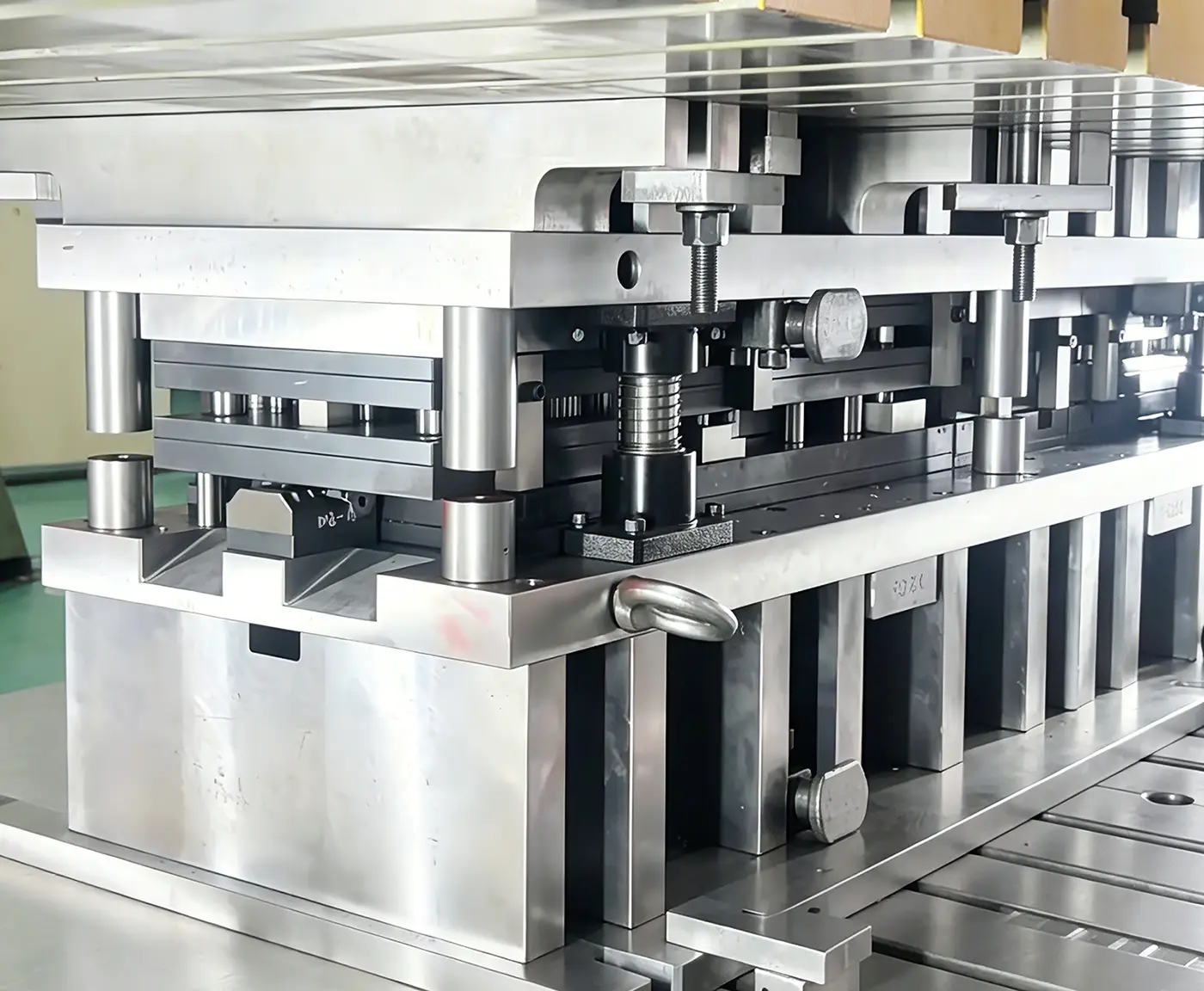 Precision progressive stamping die tooling for custom high-volume sheet metal stamping production